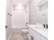 Bathroom showcasing white subway tile in the shower and matching vanity with quartz countertop at 12561 Sw 81St St, Dunnellon, FL 34432