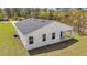 Rear exterior of home with a covered patio at 12561 Sw 81St St, Dunnellon, FL 34432