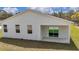 New home featuring white exterior with patio and sliding glass door at 12561 Sw 81St St, Dunnellon, FL 34432
