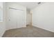 Bright bedroom with a sliding closet, carpeted floor, and neutral paint at 1324 Oak Valley Dr, Auburndale, FL 33823