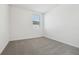 Cozy bedroom filled with natural light, plush carpet, and neutral paint at 1324 Oak Valley Dr, Auburndale, FL 33823