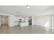 Open-concept kitchen and living area, featuring stainless steel appliances and tile floors at 1324 Oak Valley Dr, Auburndale, FL 33823