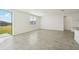 Bright living space with tile flooring and sliding glass doors to the backyard at 1324 Oak Valley Dr, Auburndale, FL 33823