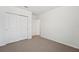 Bedroom featuring neutral carpet and a closet with sliding doors at 1337 Oak Valley Dr, Auburndale, FL 33823