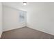 Clean and bright bedroom with neutral carpet and a window at 1337 Oak Valley Dr, Auburndale, FL 33823