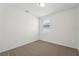 Cozy bedroom with neutral carpet and a window at 1337 Oak Valley Dr, Auburndale, FL 33823
