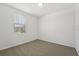 Bright bedroom with carpet, a window, and neutral wall color at 1337 Oak Valley Dr, Auburndale, FL 33823