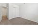 Bedroom featuring neutral carpet and a closet with sliding doors at 1337 Oak Valley Dr, Auburndale, FL 33823
