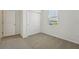 Cozy bedroom featuring carpeted floors, a window, and a closet at 1337 Oak Valley Dr, Auburndale, FL 33823