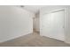 Bright bedroom featuring neutral carpet and a closet with sliding doors at 1337 Oak Valley Dr, Auburndale, FL 33823