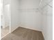 Walk-in closet with carpet, wire shelving, and white walls at 1337 Oak Valley Dr, Auburndale, FL 33823