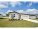 Charming one-story home featuring a well-kept lawn and a two-car garage, perfect for a Gathering at 1337 Oak Valley Dr, Auburndale, FL 33823