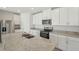 Modern kitchen with stainless steel appliances, granite countertops, and center island at 1337 Oak Valley Dr, Auburndale, FL 33823