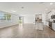 Bright living space with stainless steel appliances, island with granite countertops and tile flooring at 1337 Oak Valley Dr, Auburndale, FL 33823