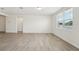 Spacious living room with large windows and tile floors, bright and airy at 1337 Oak Valley Dr, Auburndale, FL 33823