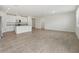 Open-concept living area featuring tile flooring, a kitchen island, and recessed lighting at 1337 Oak Valley Dr, Auburndale, FL 33823