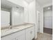 Bathroom features a double vanity, a tile floor, and a separate shower at 1341 Oak Valley Dr, Auburndale, FL 33823