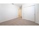 Bright bedroom featuring neutral carpet and closet space at 1341 Oak Valley Dr, Auburndale, FL 33823