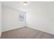 Bright bedroom featuring neutral carpet and a window at 1341 Oak Valley Dr, Auburndale, FL 33823