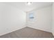 Bedroom featuring neutral carpet and a window at 1341 Oak Valley Dr, Auburndale, FL 33823