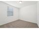 Cozy bedroom with neutral carpet and a window at 1341 Oak Valley Dr, Auburndale, FL 33823