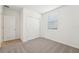 Comfortable bedroom with carpet flooring, sliding closet doors and a window at 1341 Oak Valley Dr, Auburndale, FL 33823