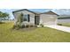 Beautiful single-Gathering home with a well manicured lawn and a two car garage at 1341 Oak Valley Dr, Auburndale, FL 33823