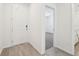 Entryway featuring tile floors and a view of a carpeted bedroom at 1341 Oak Valley Dr, Auburndale, FL 33823