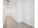 Hallway featuring ceramic tiling and a white entry door at 1341 Oak Valley Dr, Auburndale, FL 33823