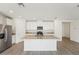 Modern kitchen with white cabinets, granite countertops and stainless steel appliances at 1341 Oak Valley Dr, Auburndale, FL 33823