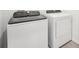 Laundry Room featuring white, front-loading washer and dryer at 1341 Oak Valley Dr, Auburndale, FL 33823