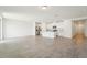 Bright, open-concept living space featuring tile flooring and a modern kitchen at 1341 Oak Valley Dr, Auburndale, FL 33823