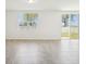 Bright open living room with access to the backyard and natural light at 1341 Oak Valley Dr, Auburndale, FL 33823