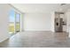 Bright open living room with access to the backyard and stainless steel refrigerator at 1341 Oak Valley Dr, Auburndale, FL 33823