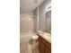 Standard bathroom featuring a shower-tub combo, toilet, and sink with cabinet at 1727 Saffron Plum Ln, Orlando, FL 32828