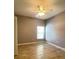 Bedroom with a window, ceiling fan, tile flooring and door at 1727 Saffron Plum Ln, Orlando, FL 32828
