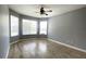 Bedroom with wood-look tile flooring, neutral paint and a ceiling fan at 1727 Saffron Plum Ln, Orlando, FL 32828