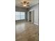 Bedroom with a window, ceiling fan, tile flooring, closet, and neutral walls at 1727 Saffron Plum Ln, Orlando, FL 32828