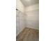 Walk-in closet with wire shelving and tile flooring at 1727 Saffron Plum Ln, Orlando, FL 32828
