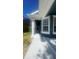 Home's front porch with classic columns, providing a welcoming entrance at 1727 Saffron Plum Ln, Orlando, FL 32828