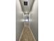 Hallway with tile floors, neutral paint, and recessed lighting at 1727 Saffron Plum Ln, Orlando, FL 32828