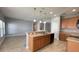 Spacious kitchen with an island, stainless steel sink and matching appliances at 1727 Saffron Plum Ln, Orlando, FL 32828
