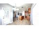 Bright kitchen with an island, tile flooring, and modern lighting fixtures at 1727 Saffron Plum Ln, Orlando, FL 32828