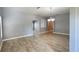 Bright living room featuring neutral paint, tile flooring, and an elegant chandelier at 1727 Saffron Plum Ln, Orlando, FL 32828