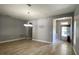Spacious living room featuring tile flooring, neutral gray walls, and views of the front door at 1727 Saffron Plum Ln, Orlando, FL 32828