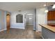 Living room area with tile floors, neutral paint, and breakfast bar seating at 1727 Saffron Plum Ln, Orlando, FL 32828