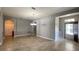 Open living area with neutral walls, tile flooring, and a view of the front door at 1727 Saffron Plum Ln, Orlando, FL 32828