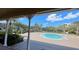 Community pool featuring palm trees and lounge chairs at 1727 Saffron Plum Ln, Orlando, FL 32828