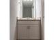 Bathroom featuring a white vanity with granite countertop and a mirrored backsplash at 2906 Fieldwood Cir, St Cloud, FL 34772