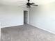 Bedroom with carpet, gray walls, and black ceiling fan at 2906 Fieldwood Cir, St Cloud, FL 34772
